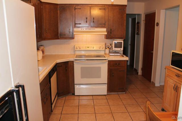 459 Nolf Road Nazareth, PA 18064 - Photo 6 of 23 a kitchen with a stove top oven and refrigerator