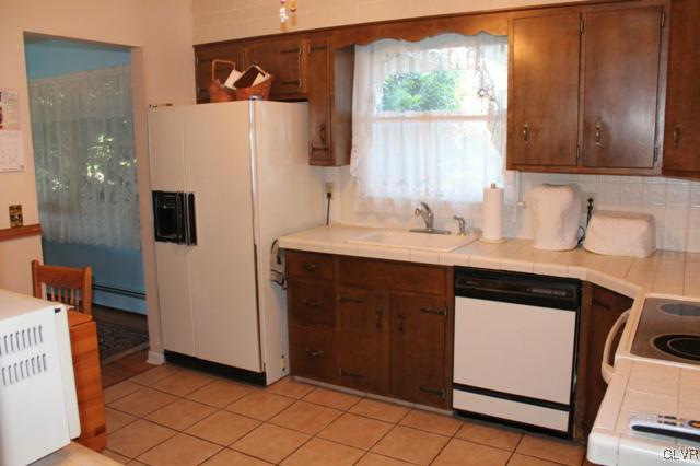 459 Nolf Road Nazareth, PA 18064 - Photo 7 of 23 a kitchen with stainless steel appliances a refrigerator sink and microwave