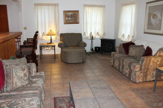 459 Nolf Road Nazareth, PA 18064 - Photo 8 of 23 a living room with couches and a potted plant on a coffee table