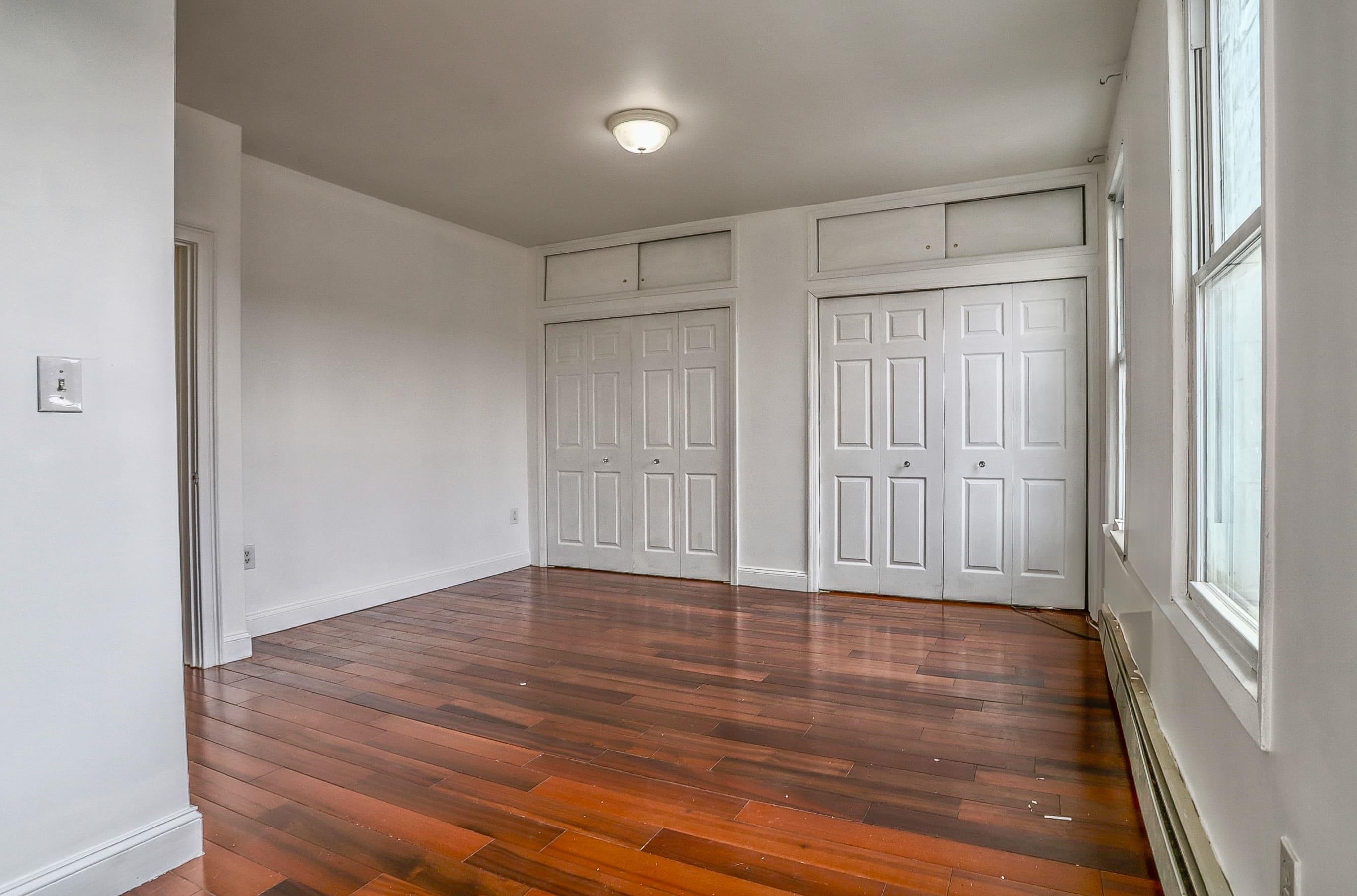 206 Dodd Street, Unit 2 Weehawken, NJ 07086 - Photo 14 of 21 a view of an empty room with wooden floor