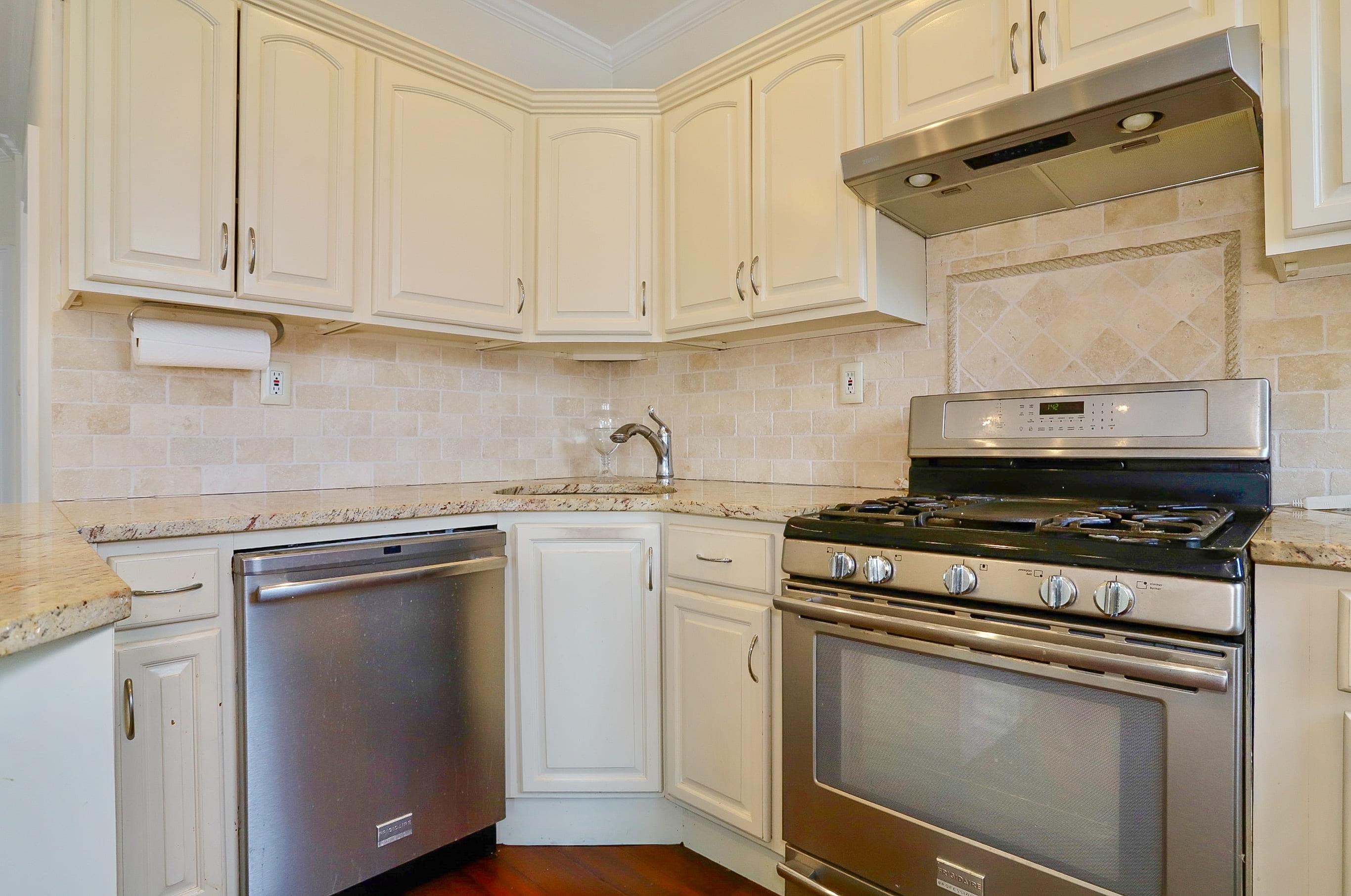 206 Dodd Street, Unit 2 Weehawken, NJ 07086 - Photo 6 of 21 a white stove top oven sitting inside of a kitchen