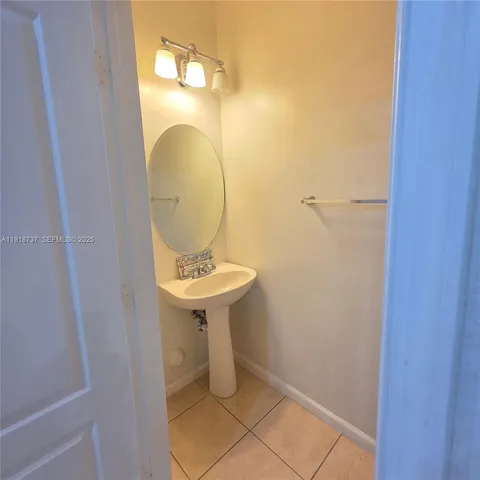 a bathroom with a sink and mirror