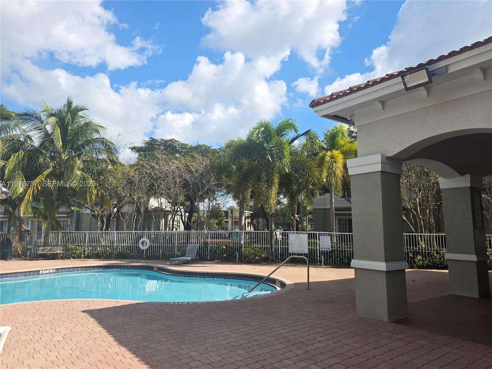 2612 Southwest 81st Terrace, Unit 206 Miramar, FL 33025 - Photo 36 of 40 a view of swimming pool with a yard