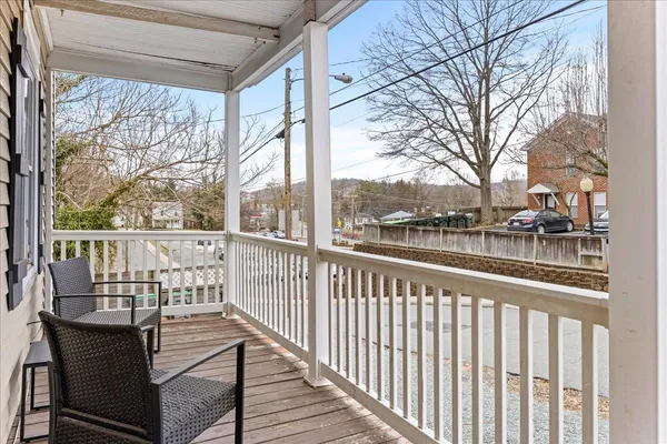a view of a balcony with wooden floor