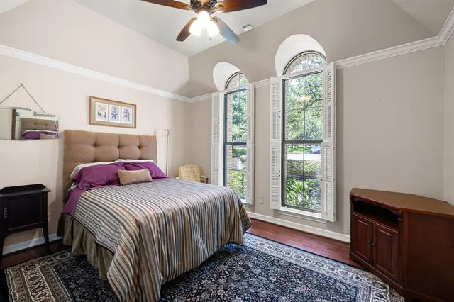 a bathroom with a granite countertop sink and a mirror with toilet