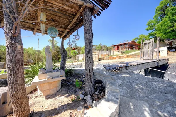 a view of backyard with a barn and a deck