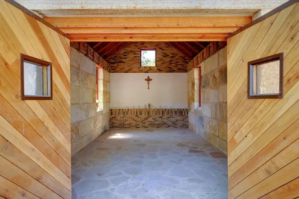a view of a wooden door in front of a house