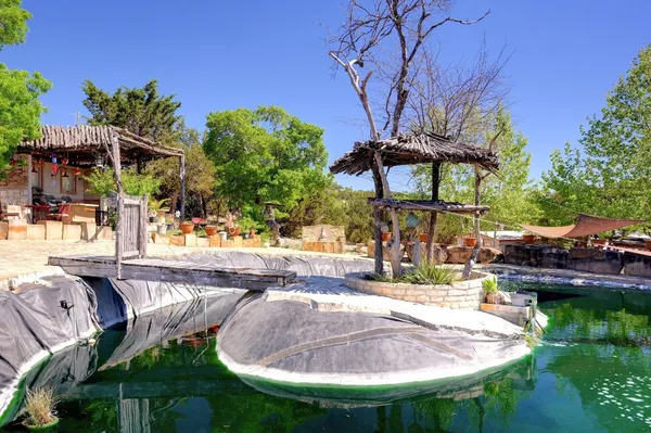 a view of a backyard with sitting area