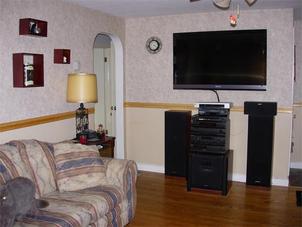 22 Santa Barbara Street Springfield, MA 01104 - Photo 13 of 23 a living room with furniture and a flat screen tv