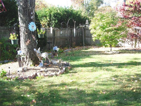 22 Santa Barbara Street Springfield, MA 01104 - Photo 20 of 23 a backyard of a house with table and chairs