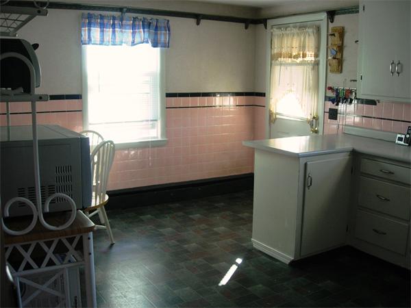 22 Santa Barbara Street Springfield, MA 01104 - Photo 8 of 23 a kitchen with a sink a refrigerator and window