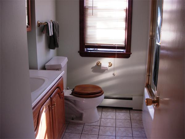 22 Santa Barbara Street Springfield, MA 01104 - Photo 9 of 23 a bathroom with a granite countertop toilet sink and mirror