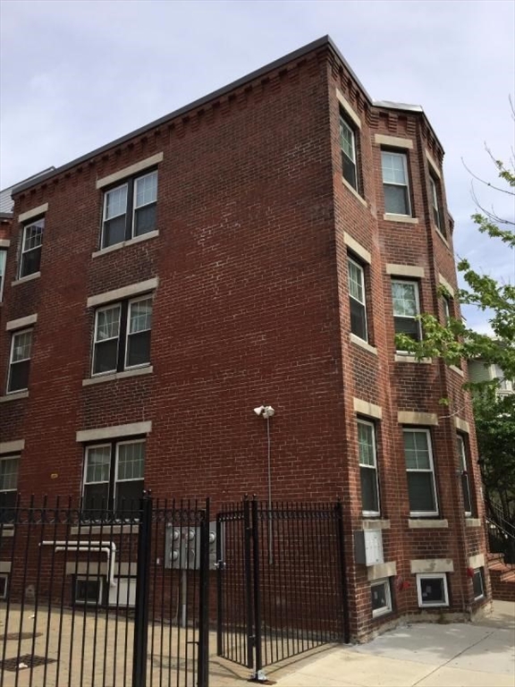 2969 Washington Street, Unit 3 Boston, MA 02119 - Photo 6 of 6 a front view of a house with glass windows