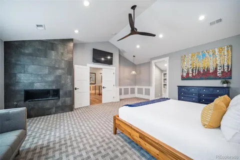 a spacious bathroom with a double vanity sink mirror and bathtub