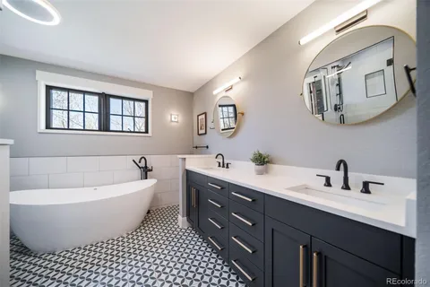 a bathroom with a bathtub and shower