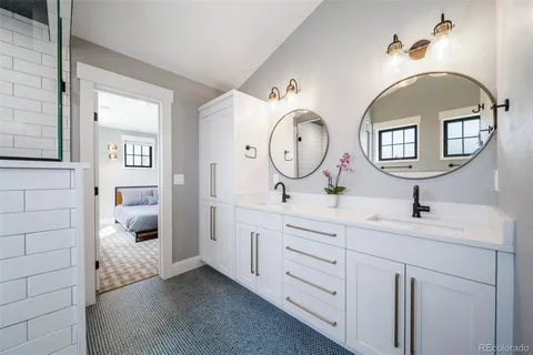 a white bath tub sitting next to a shower