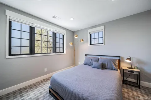 a kitchen with stainless steel appliances granite countertop a sink and a refrigerator