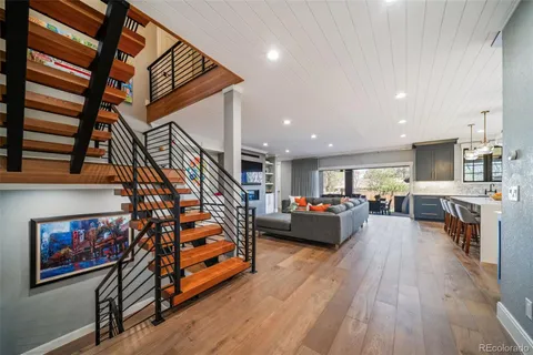 a bedroom with furniture and a flat screen tv