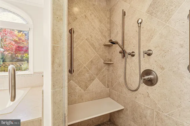 a spacious bedroom with a bed and a flat screen tv