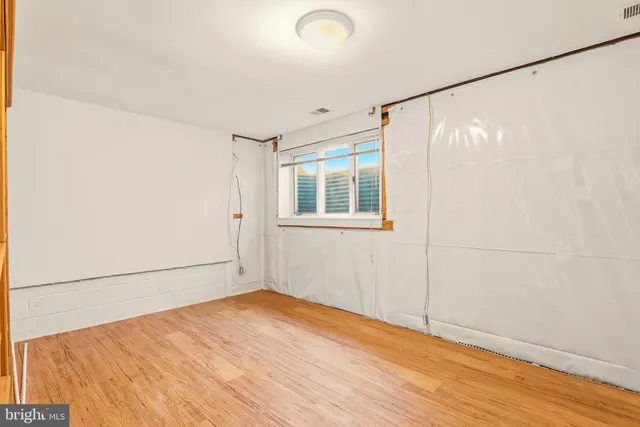 a backyard of a house with a yard and outdoor seating