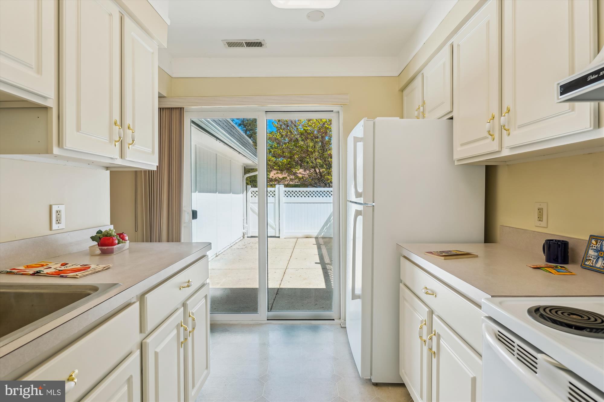3702 Marble Arch Way, Unit 31B Silver Spring, MD 20906 - Photo 3 of 35 Galley Kitchen, view towards patio.