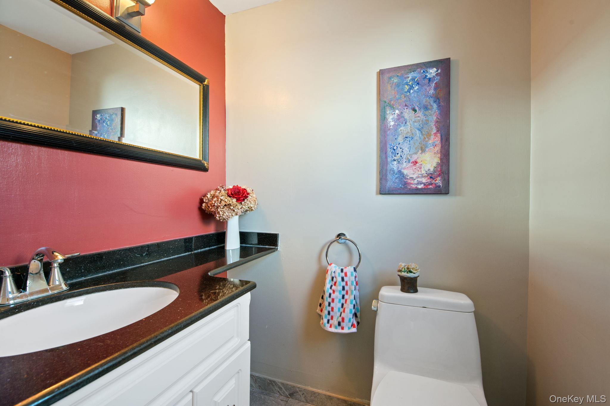 89 Nottingham Road Manhasset Hills, NY 11040 - Photo 11 of 44 a bathroom with a sink and a mirror