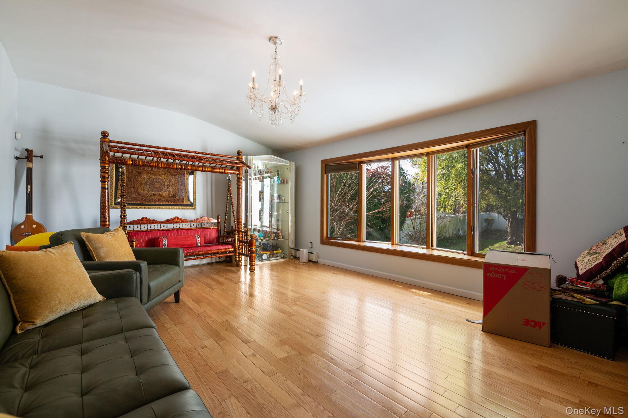 89 Nottingham Road Manhasset Hills, NY 11040 - Photo 17 of 44 a living room with furniture and a large window