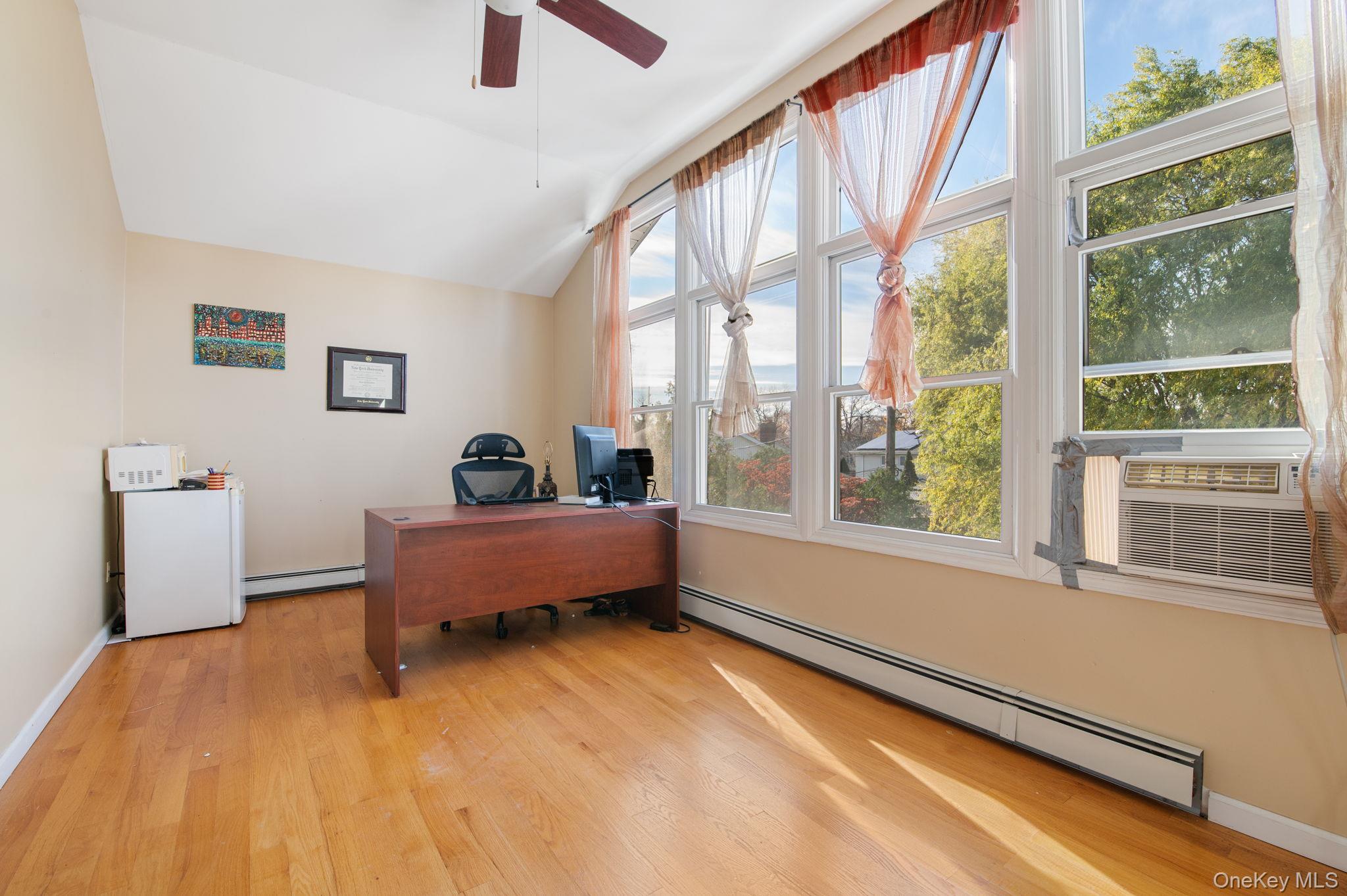 89 Nottingham Road Manhasset Hills, NY 11040 - Photo 30 of 44 a bedroom with furniture and a window