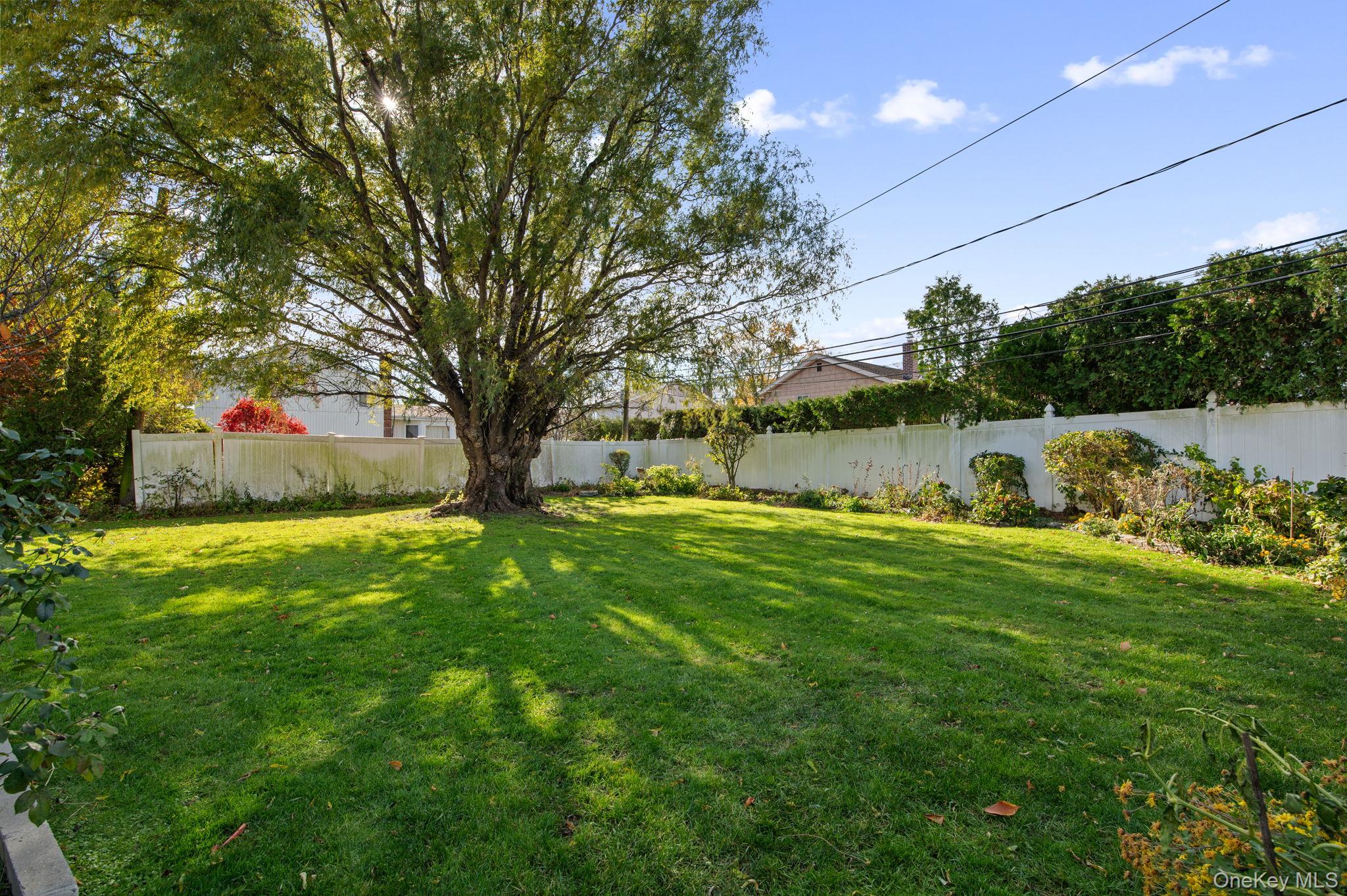 89 Nottingham Road Manhasset Hills, NY 11040 - Photo 36 of 44 a view of yard with swimming pool and outdoor seating