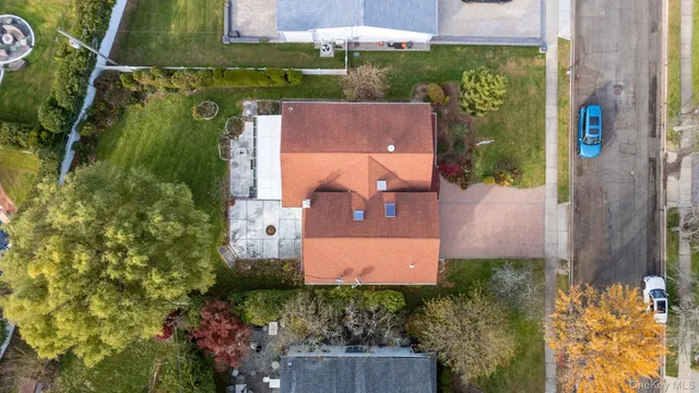 an aerial view of a house with a garden