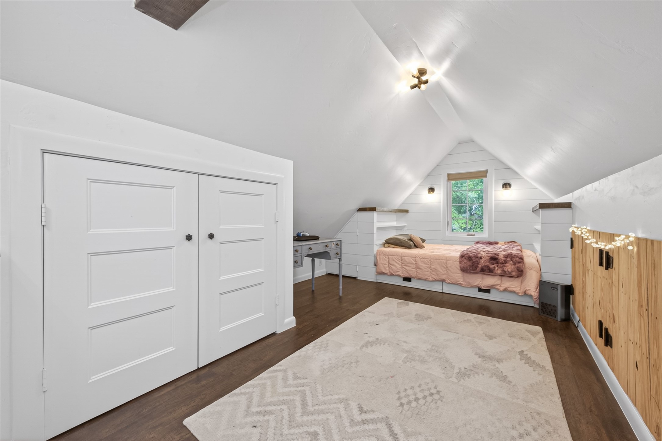 10 Belcarra Place Spring, TX 77382 - Photo 25 of 49 One view of the bonus room or 4th bedroom located upstairs. Built-in queen sized bed with book shelves & wood shiplap panels for beautiful design. Vinyl plank flooring in this room. Built in storage areas on both sides of the room.