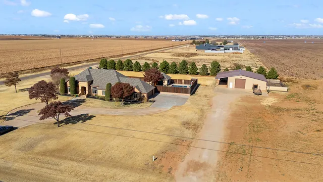 a view of a terrace with lawn chairs