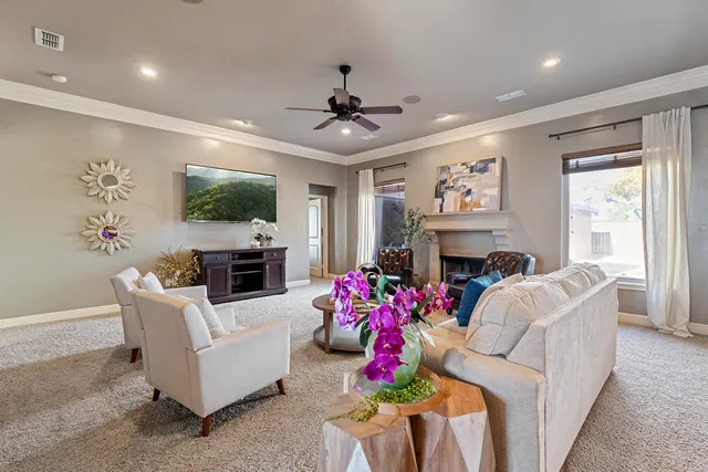a kitchen with stainless steel appliances granite countertop a stove a sink and white cabinets