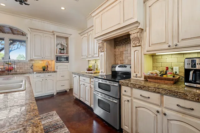 a kitchen with granite countertop lots of counter top space