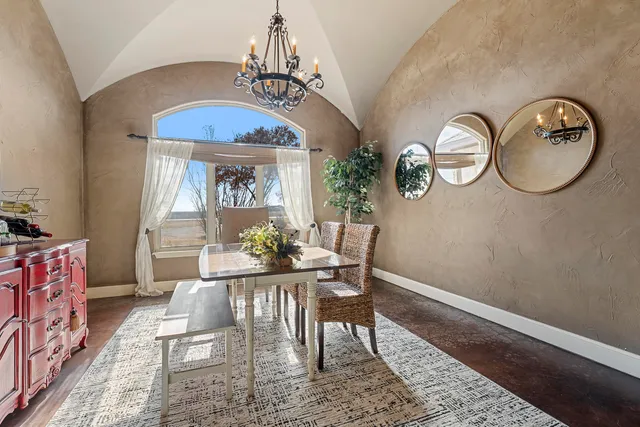 a bathroom with a granite countertop sink a mirror and a shower