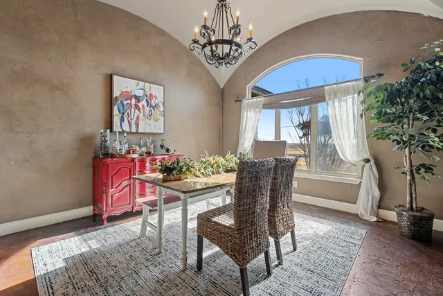 a spacious bedroom with a bed and a couch