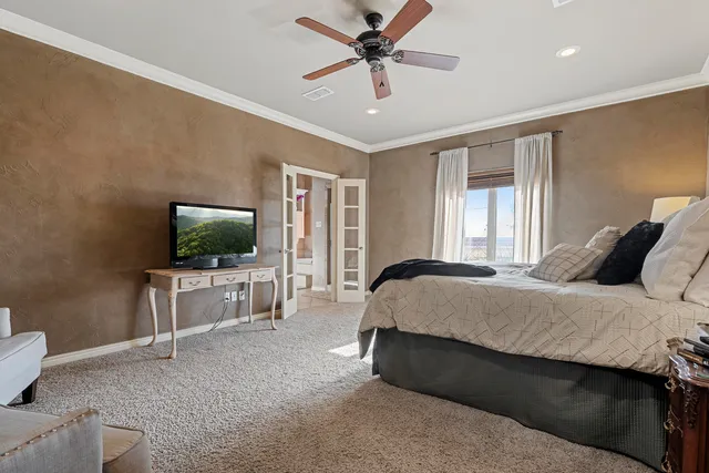 a bedroom with a bed and a desk