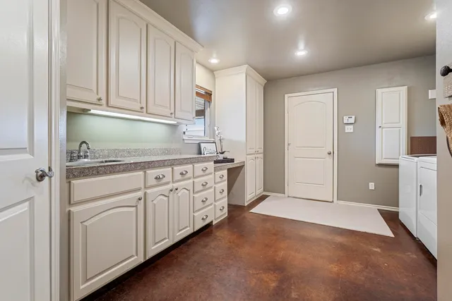 a patio with a table and chairs