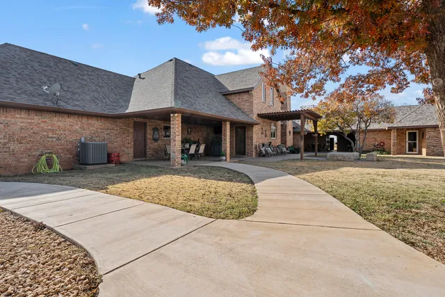 a view of swimming pool with lounge chair and dinning table