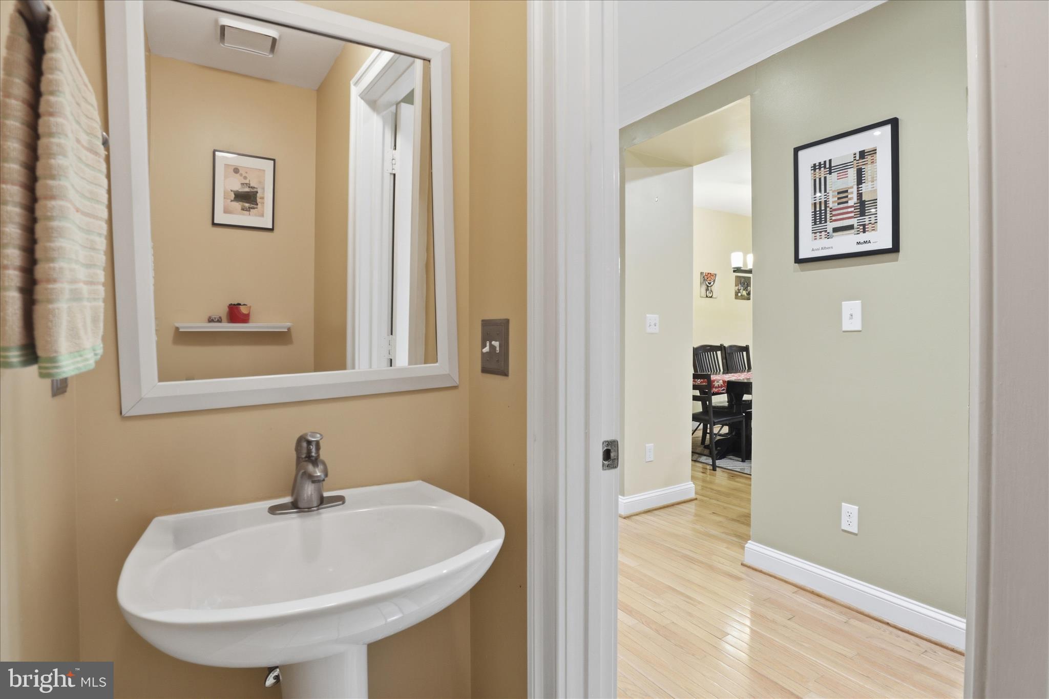 1319 Sundial Drive Reston, VA 20194 - Photo 11 of 49 a bathroom with a sink and a mirror