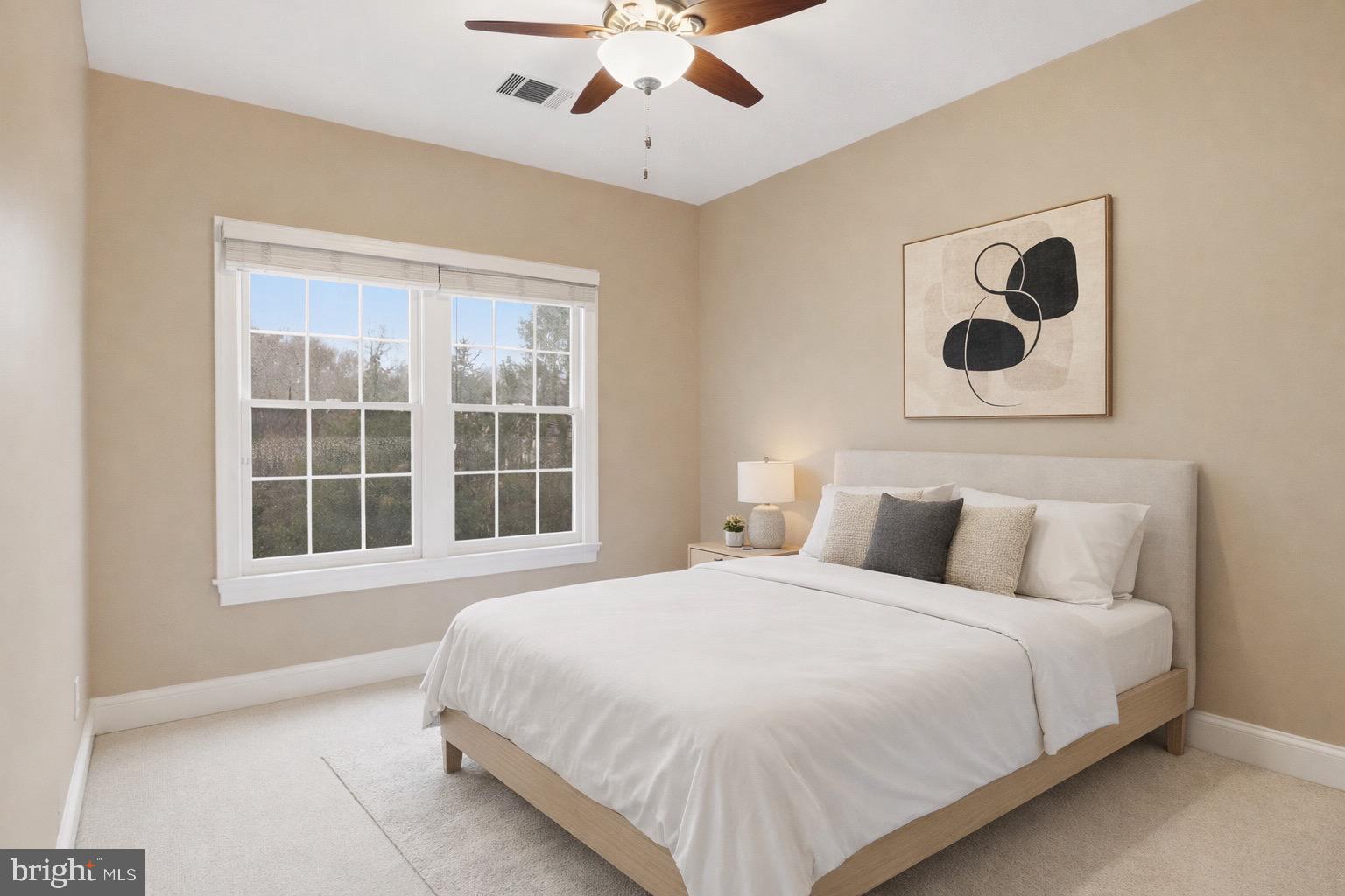 1319 Sundial Drive Reston, VA 20194 - Photo 19 of 49 a bedroom with a bed and a large window