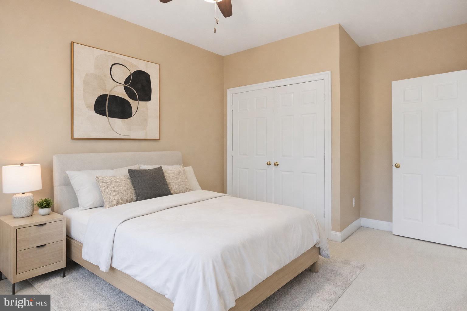 1319 Sundial Drive Reston, VA 20194 - Photo 20 of 49 a bedroom with a bed and wall painting