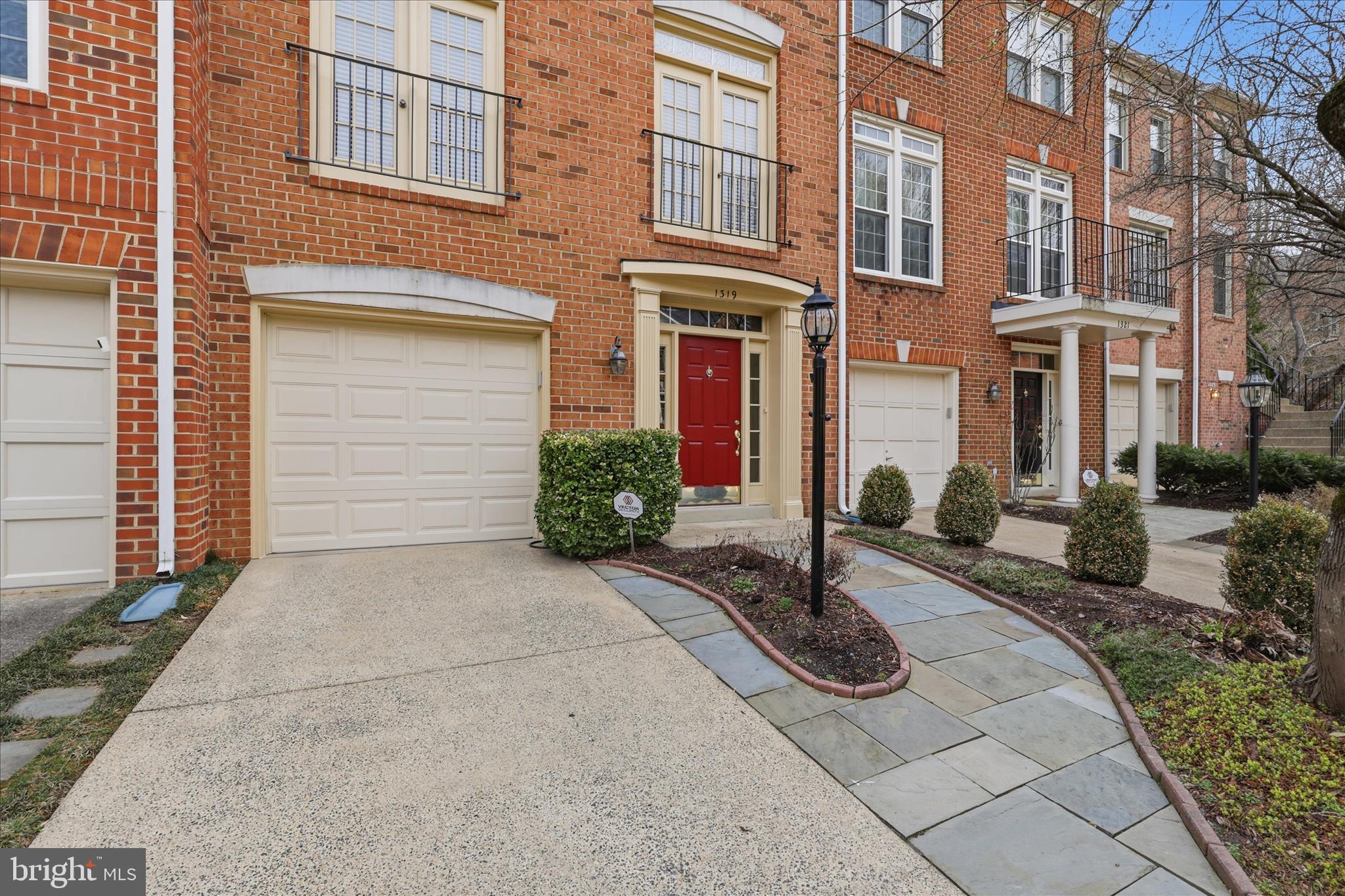 1319 Sundial Drive Reston, VA 20194 - Photo 3 of 49 a view of a building with potted plants
