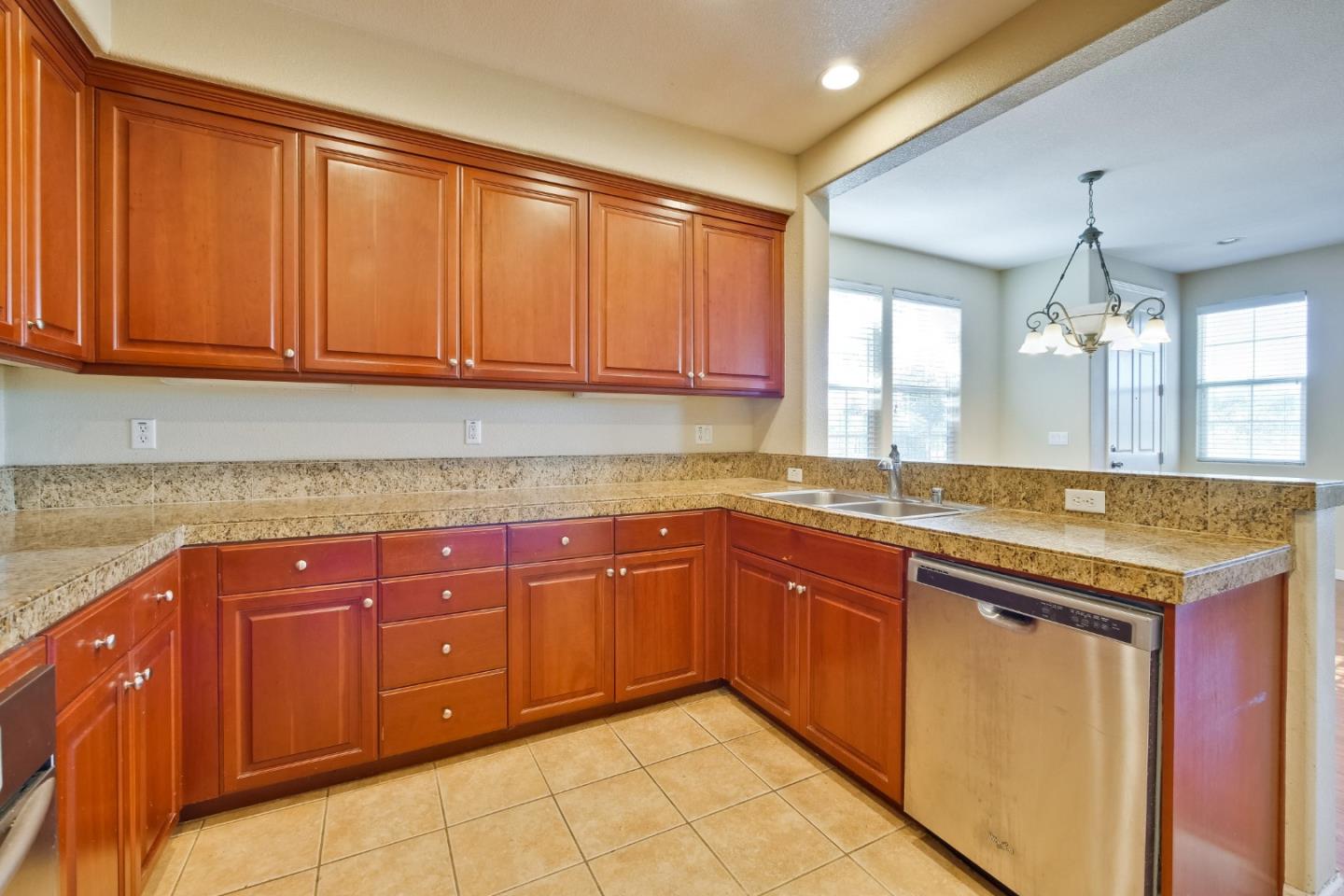 811 Joree Lane San Ramon, CA 94582 - Photo 19 of 43 a kitchen with granite countertop cabinets and window