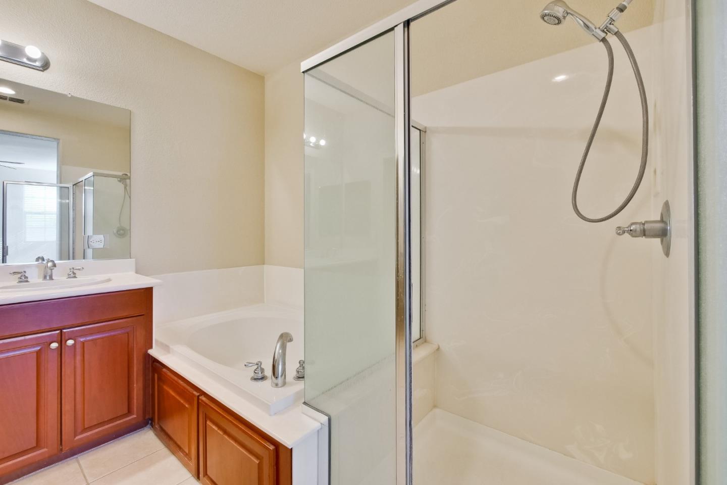 811 Joree Lane San Ramon, CA 94582 - Photo 33 of 43 a bathroom with a tub sink shower and mirror