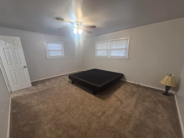 a kitchen with a stove and a window