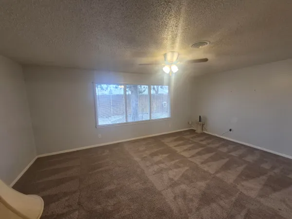 an empty room with a empty space and windows