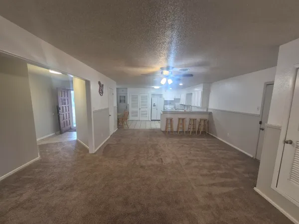 a view of a livingroom with furniture and a chandelier