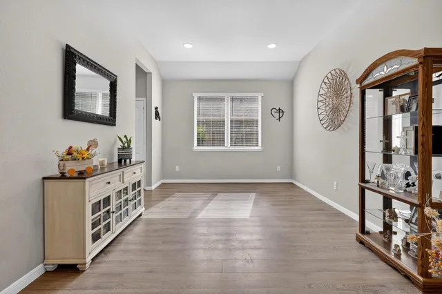 a view of an entryway with wooden floor