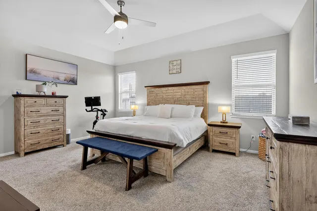 a bed room with a bed and a tv